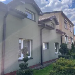 Ocieplenie budynku wraz z nałożeniem tynku (maszynowo)