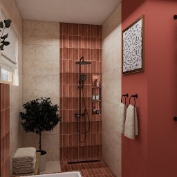 Emilia Kozłowska Projekty z Pasją - Nowoczesna łazienka z kabiną prysznicową wyłożoną ceglastymi płytkami, czarną armaturą i dekoracyjną grafiką na koralowej ścianie. Minimalistyczny design z rośliną w doniczce.