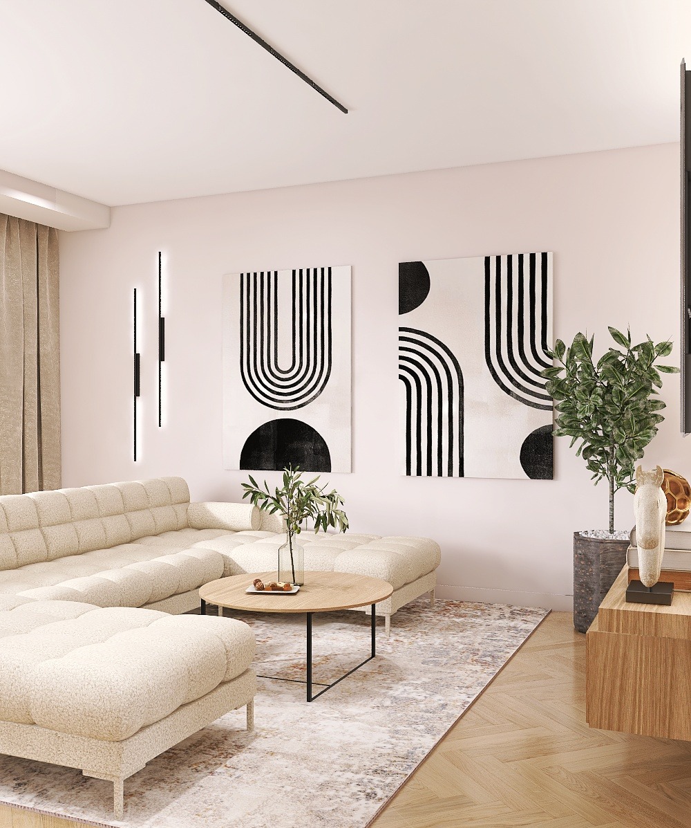 Jasny salon z narożną sofą i okrągłym stolikiem kawowym. Na ścianie abstrakcyjne obrazy w czarno-białej kolorystyce i pionowe lampy. Parkiet na podłodze.