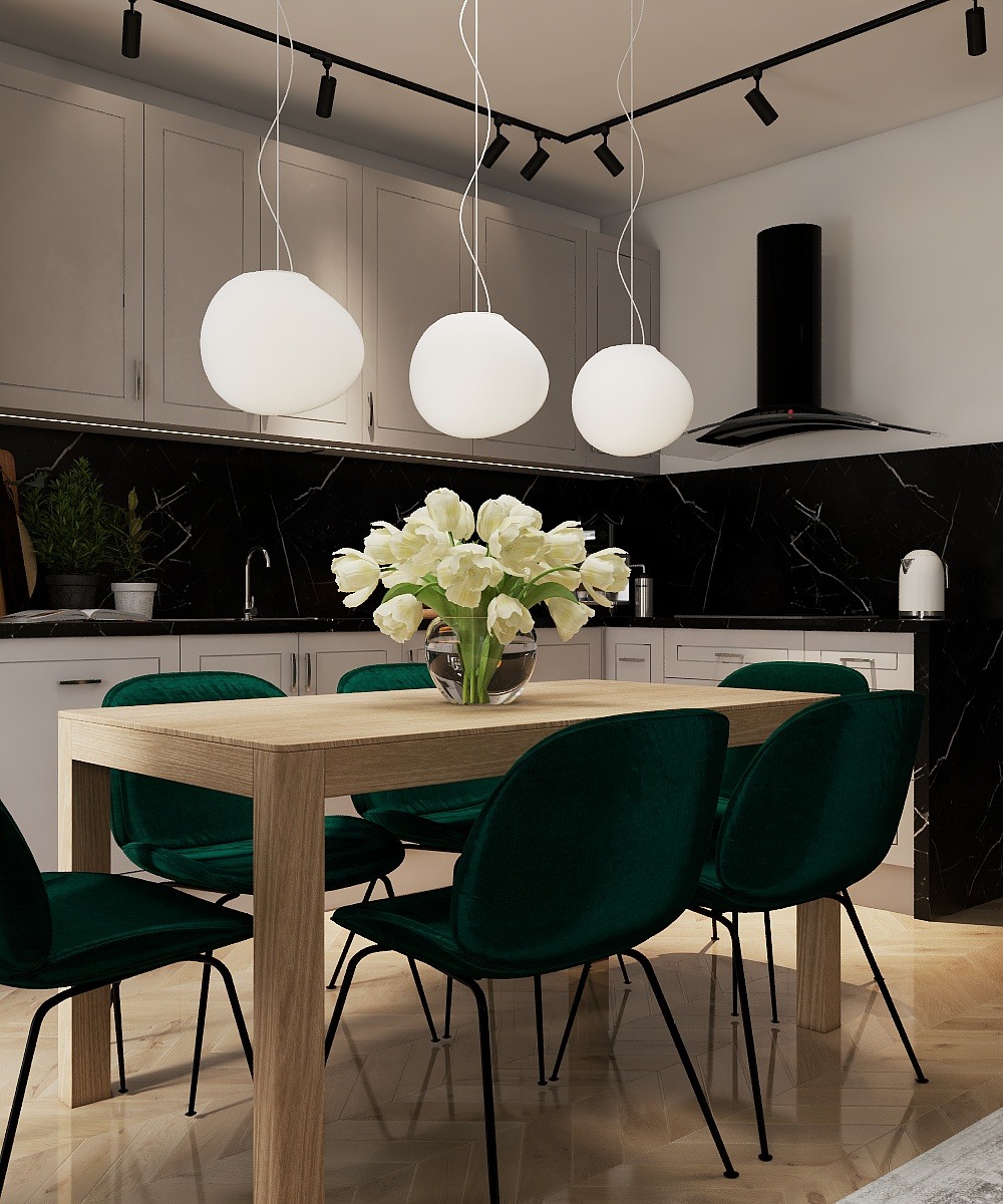 Nowoczesna aranżacja jadalni w Bydgoszczy: drewniany stół, zielone krzesła, marmurowa ściana i designerskie lampy. Minimalistyczny styl z akcentem na naturalne materiały.