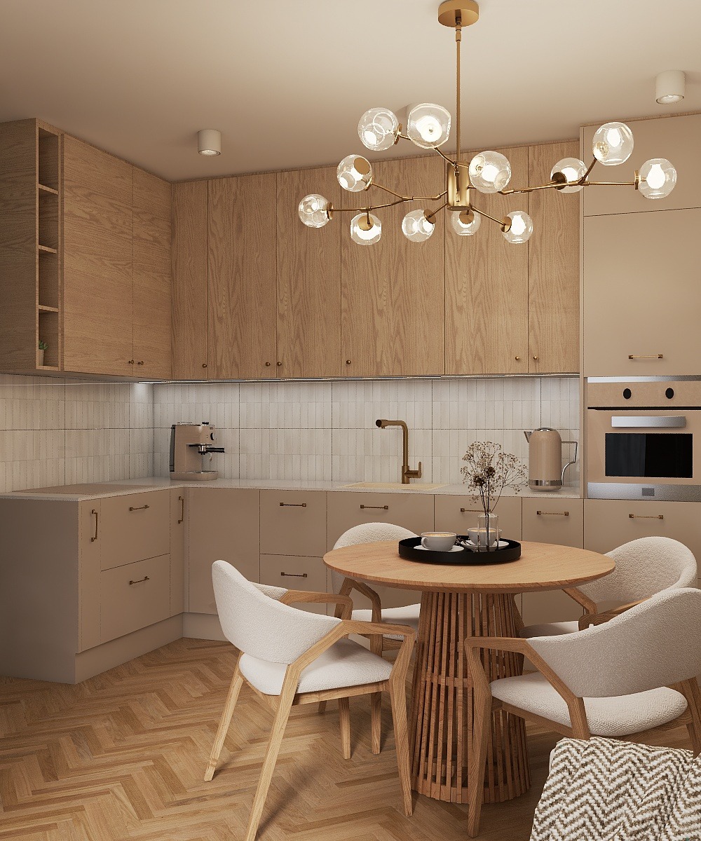 Jasna kuchnia z drewnianymi szafkami, okrągłym stołem i nowoczesną lampą. Minimalistyczny design, ciepłe oświetlenie, parkiet w jodełkę. Aranżacja wnętrza z dbałością o detale.