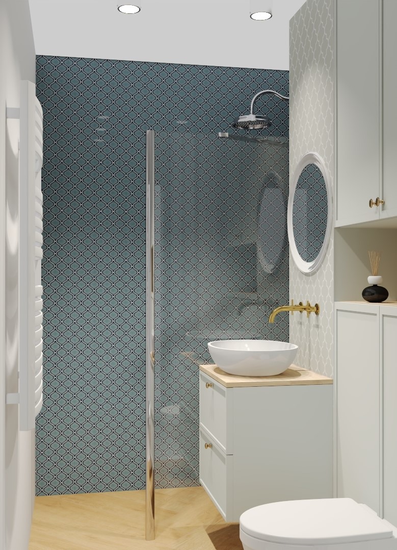 Nowoczesna łazienka z kabiną prysznicową w stylu marokańskim, białą umywalką nablatową i złotą armaturą, drewniana podłoga ułożona w jodełkę.