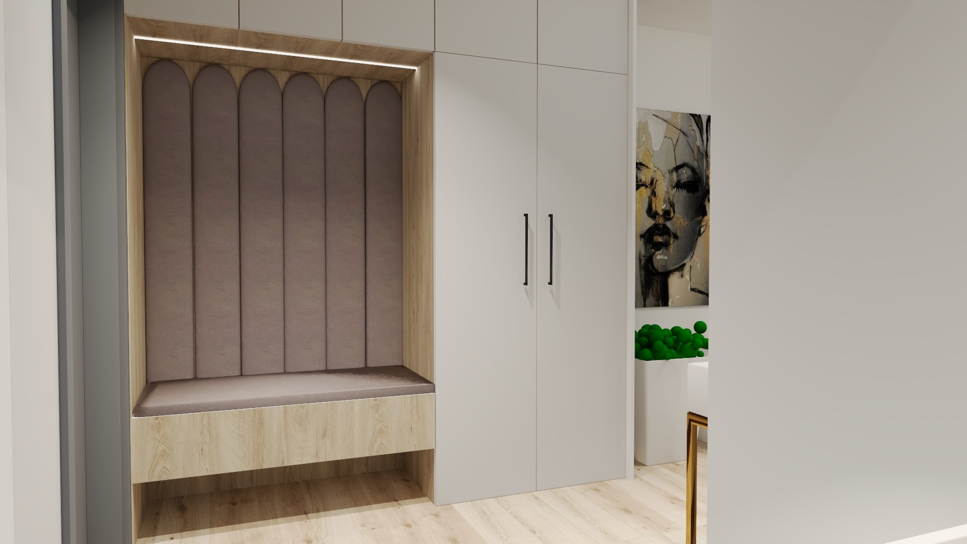 Wnęka z tapicerowanym panelem ściennym w odcieniach beżu i siedziskiem z jasnego drewna, wkomponowana w białą zabudowę szafy, z obrazem kobiety w tle.