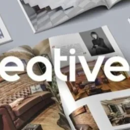 Rozłożony katalog prezentujący zdjęcia wnętrz z ceglanymi ścianami, nowoczesnymi meblami i oświetleniem, z nałożonym logo 'Ukreative pro'.