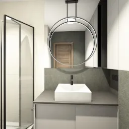 Mała łazienka w odcieniach szarości.