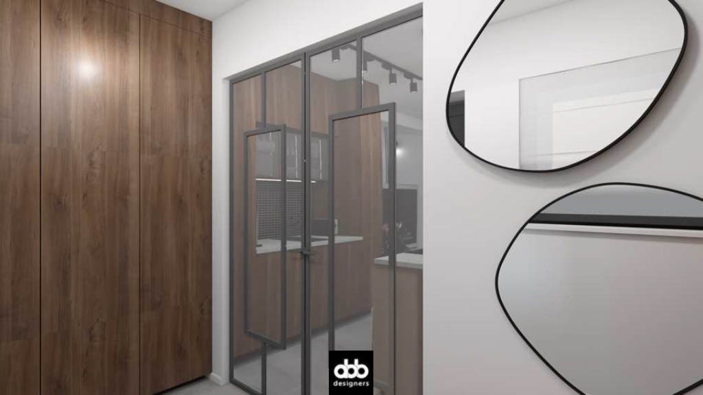 Nowoczesne wnętrze: zabudowa szafy z drewnianymi frontami, przeszklona ściana działowa z grafitowymi ramami i dwa asymetryczne lustra w czarnych obramowaniach.