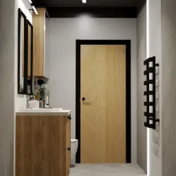 Nowoczesna łazienka z drewnianą szafką pod umywalką, dużym lustrem, drewnianymi drzwiami z czarną ramą i czarnym grzejnikiem drabinkowym na tle szarej ściany z pionowym oświetleniem LED.