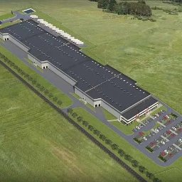 Janas Logistics Sp. z o.o. - Wizualizacja z lotu ptaka dużego magazynu logistycznego z parkingiem i placem manewrowym dla ciężarówek, otoczonego zielonym terenem.