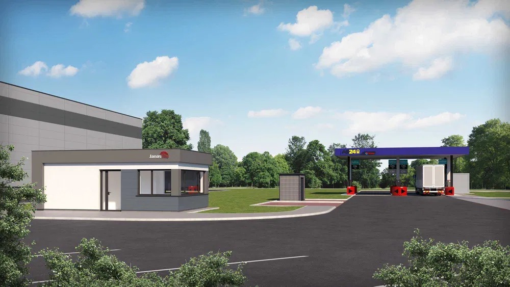 Wizualizacja stacji paliw dla transportu ciężarowego z budynkiem biurowym, dystrybutorami i zaparkowaną ciężarówką, otoczonej zielenią.