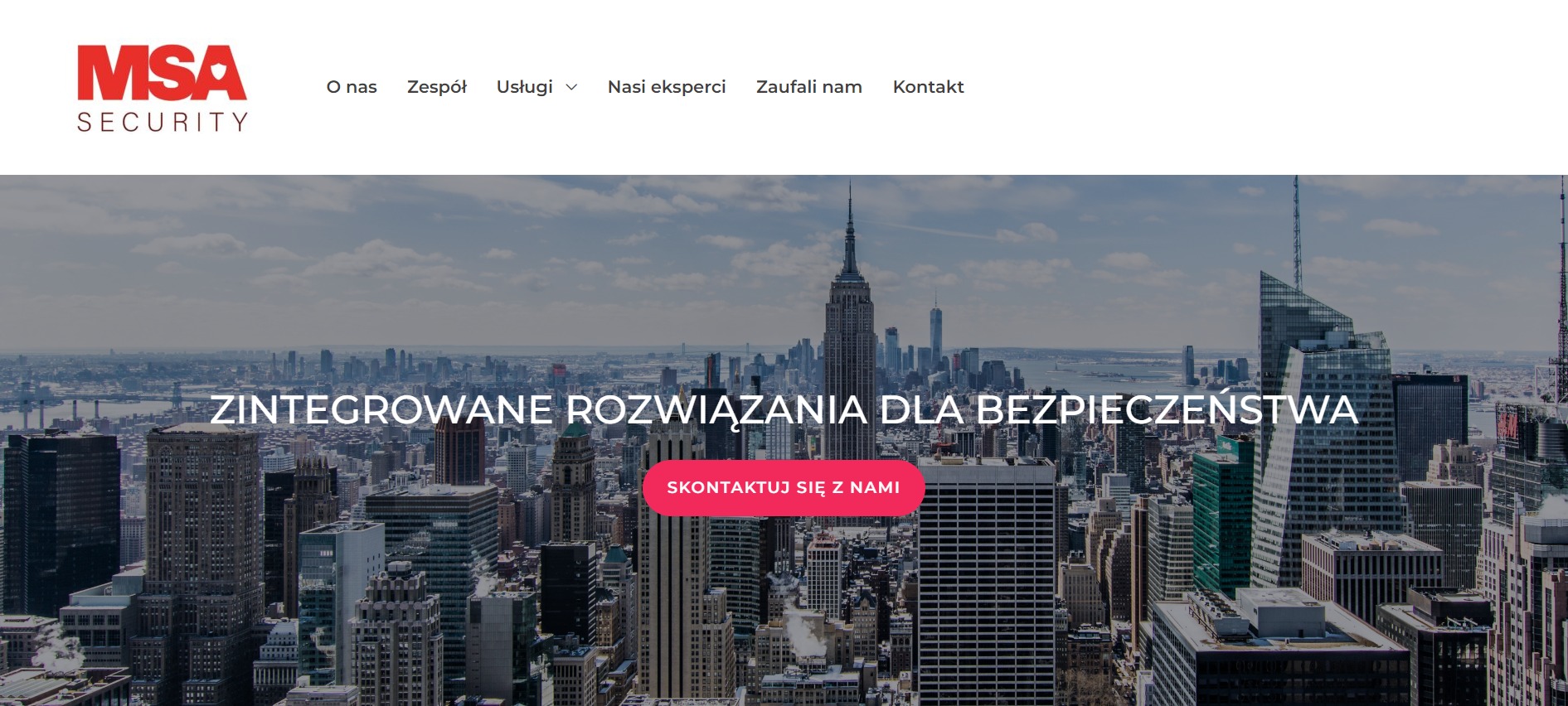 Strona internetowa firmy MSA Security z widokiem na panoramę Nowego Jorku w tle, z menu nawigacyjnym u góry i hasłem 'Zintegrowane rozwiązania dla bezpieczeństwa' oraz przyciskiem 'Skontaktuj się...