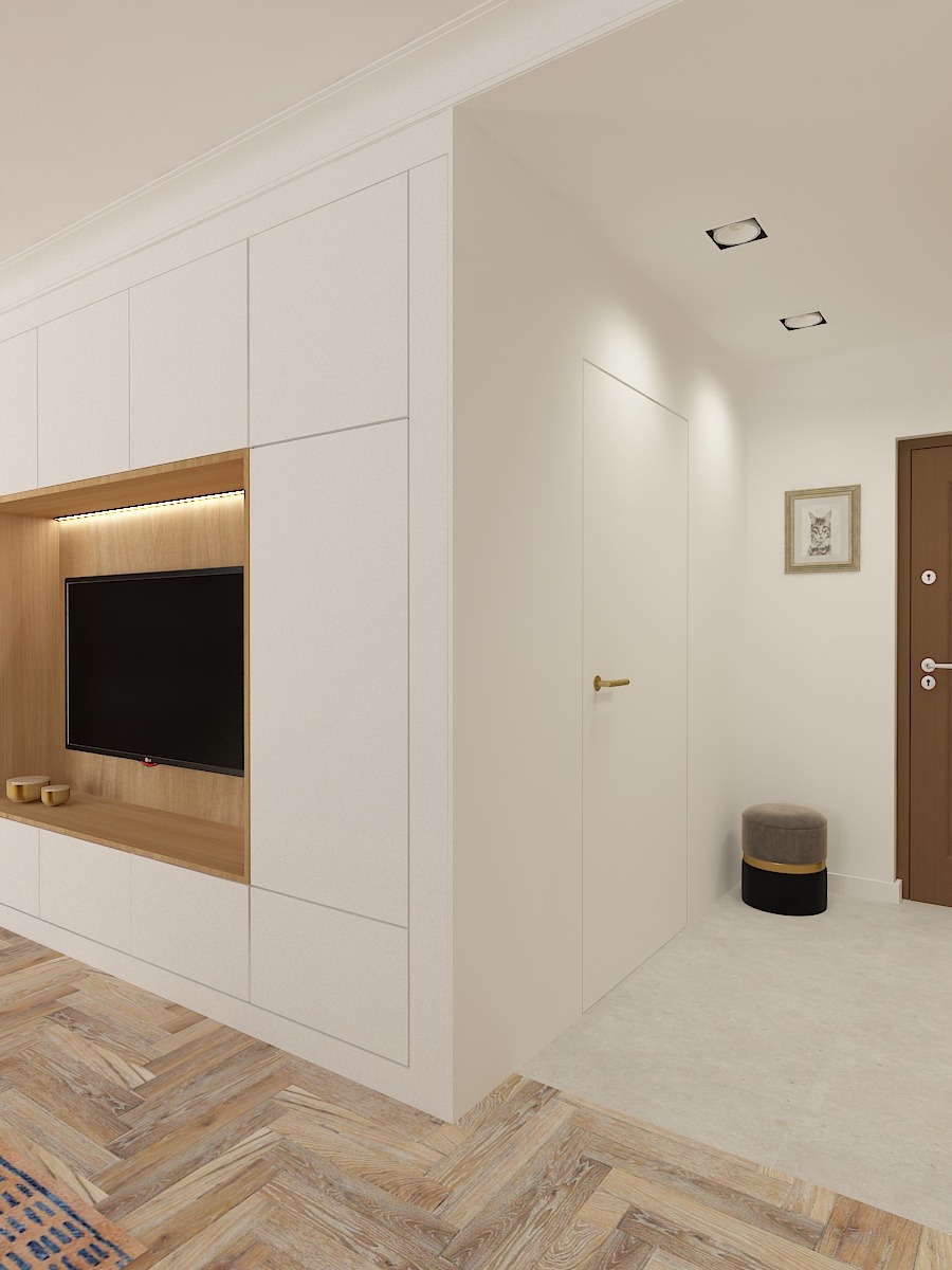 Minimalistyczne wnętrze: zabudowa meblowa z telewizorem, drewniana podłoga w jodełkę, ukryte drzwi i pufa.