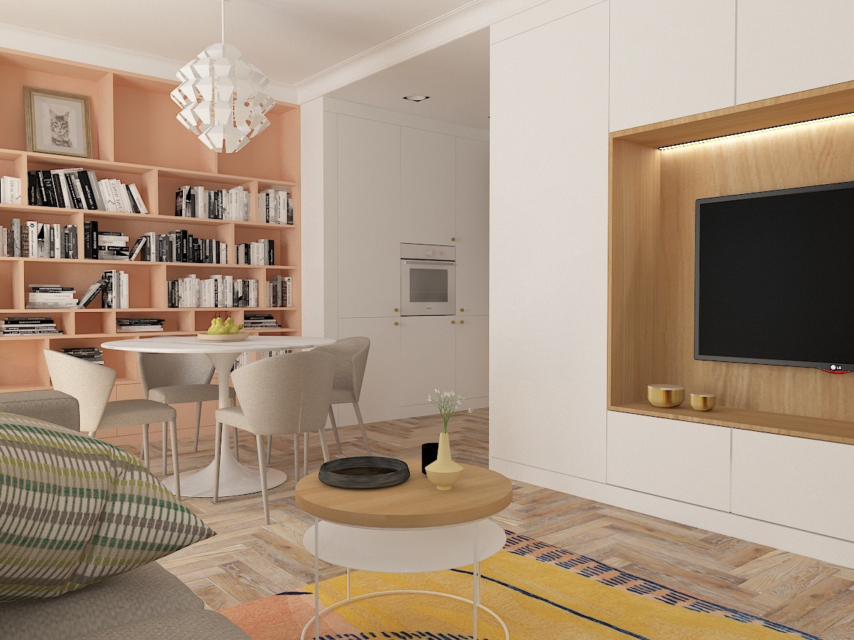 Jasne, nowoczesne wnętrze z regałem na książki w odcieniach brzoskwini, okrągłym stołem z owocami, telewizorem w drewnianej obudowie i parkietem ułożonym w jodełkę.
