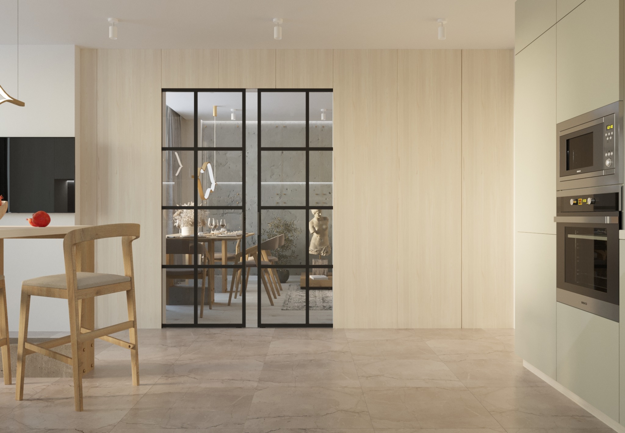 Nowoczesna kuchnia z beżowymi frontami, drewnianą ścianą i przesuwnymi drzwiami w czarnej ramie, przez które widać jadalnię z rzeźbą.