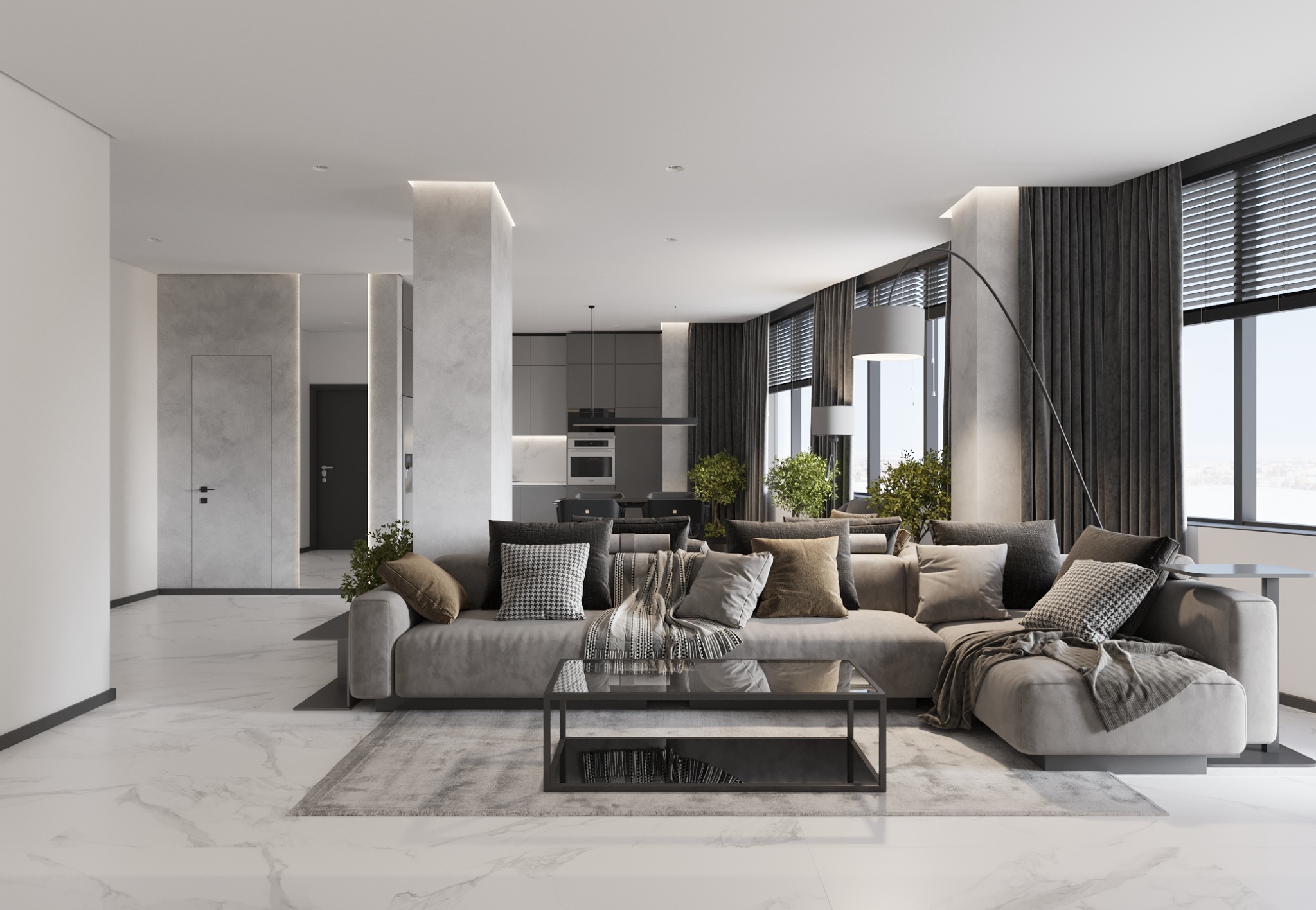 Nowoczesny salon z szarą sofą narożną, szklanym stolikiem kawowym, marmurową podłogą i otwartą kuchnią w tle.