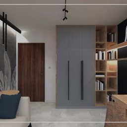 Wnętrza Dabińska - Wizualizacja pokoju z szarą szafą, regałem z książkami, biurkiem z laptopem i sofą z niebieskimi poduszkami, oświetlenie punktowe na suficie, dekoracyjna tapeta z motywem liści.