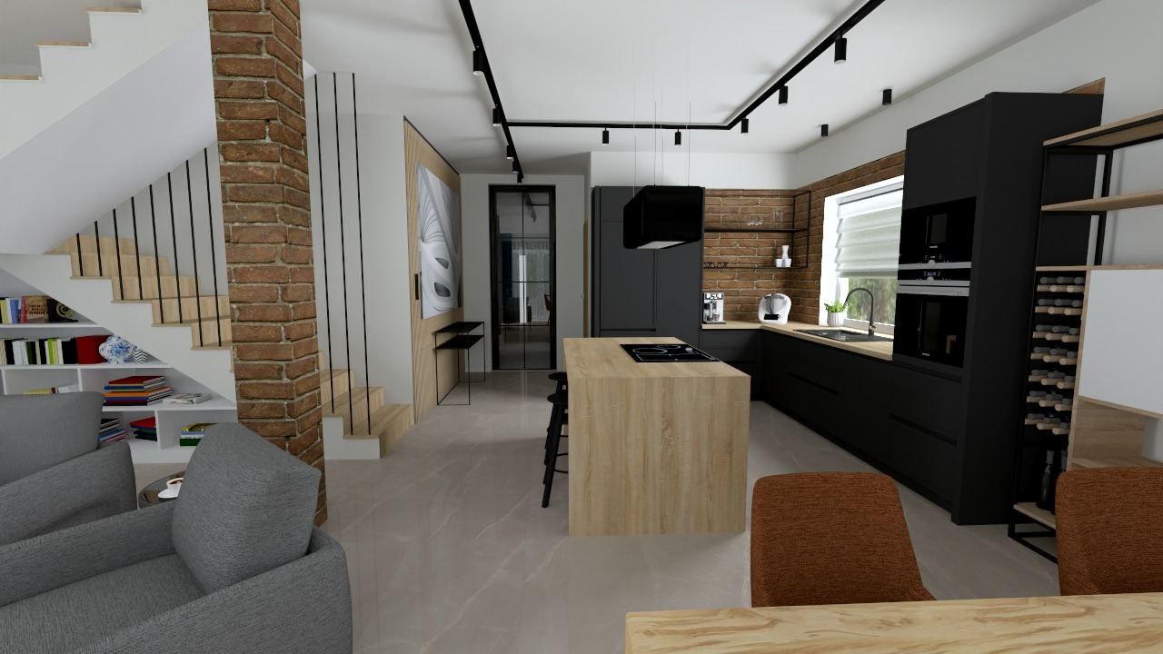Nowoczesna kuchnia z wyspą i ceglaną ścianą, czarne szafki, drewniana wyspa z płytą indukcyjną, widok na schody z biblioteczką pod nimi.