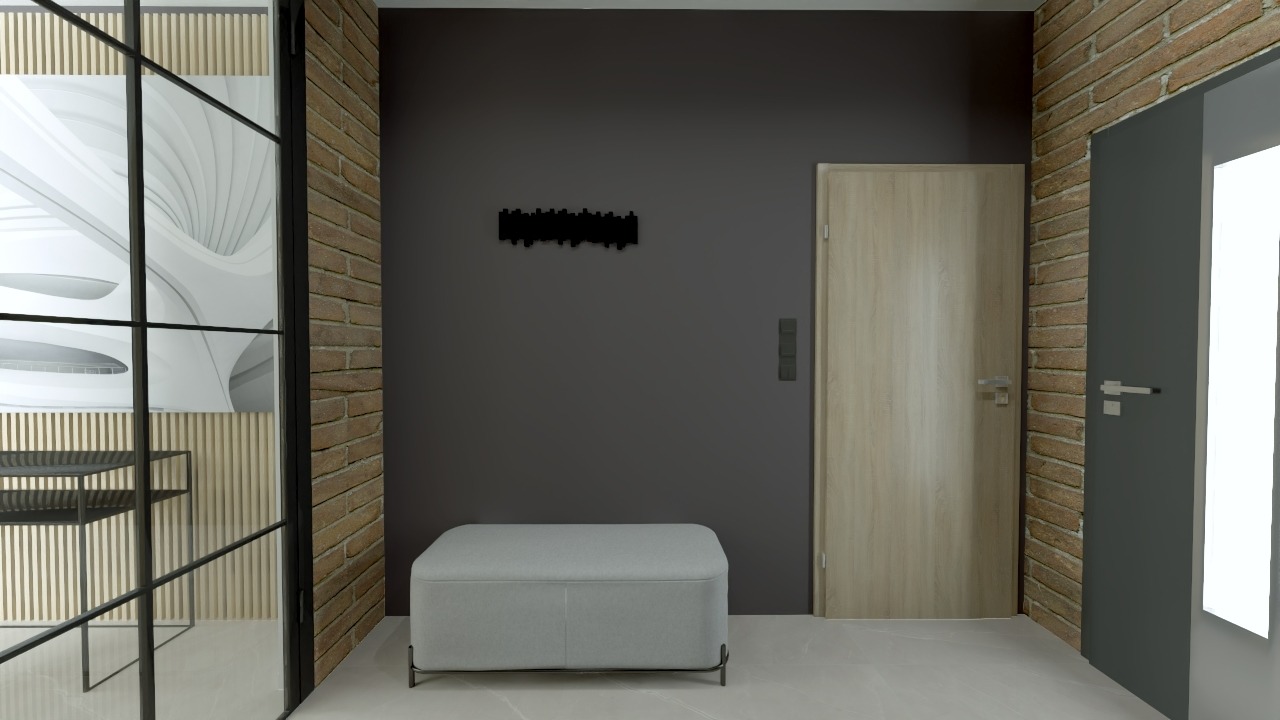 Nowoczesny przedpokój z szarą ścianą, minimalistycznym wieszakiem, pufą i dwoma drzwiami, w tym jedne z ceglaną framugą.