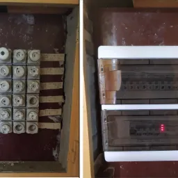 Porównanie: Stara tablica bezpiecznikowa z ceramicznymi wkładkami obok nowej, dwurzędowej tablicy z wyłącznikami nadprądowymi, widoczne oznaczenia obwodów i czerwona dioda sygnalizacyjna.