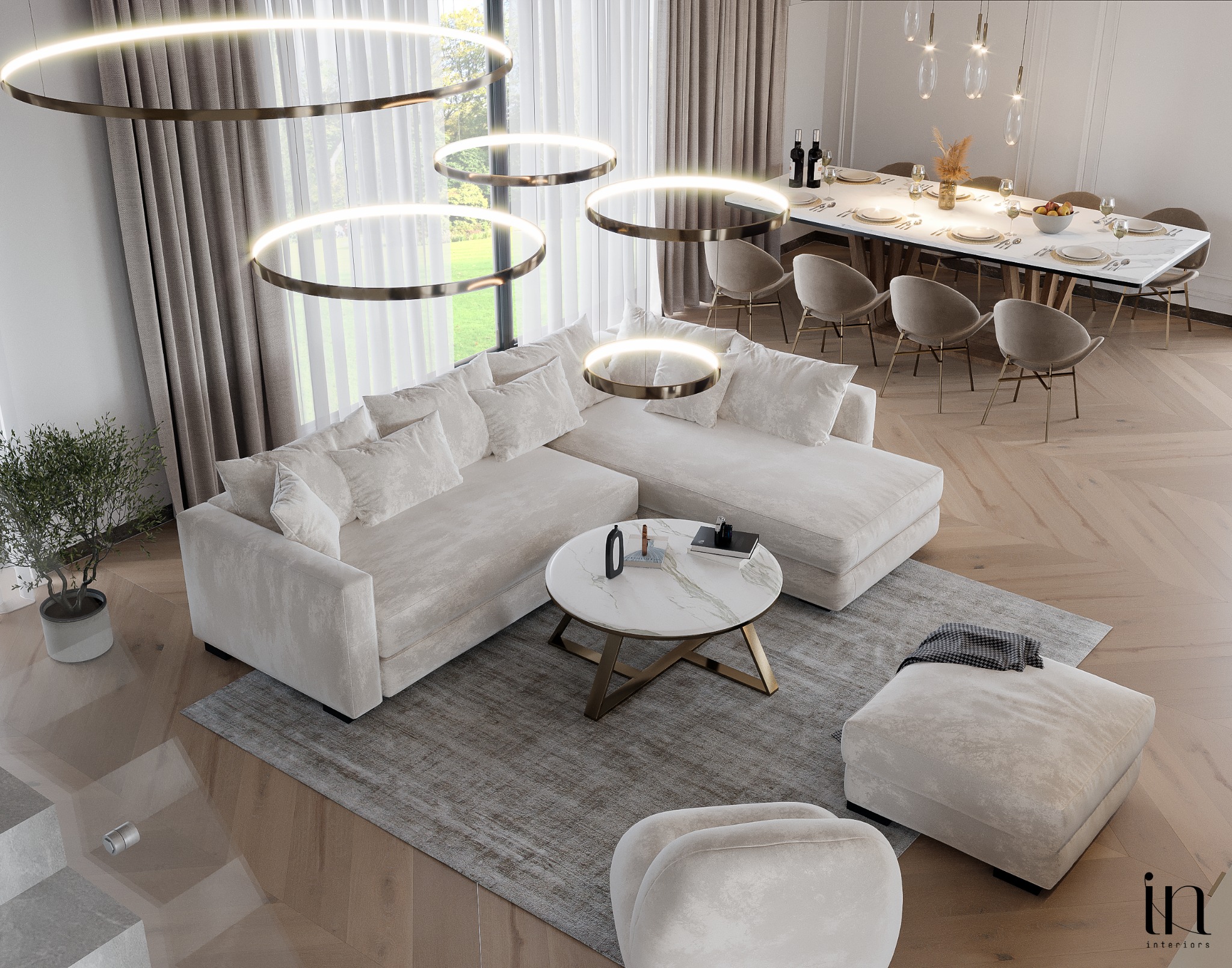 Elegancki salon z narożną sofą w odcieniach beżu, okrągłym stolikiem kawowym z marmurowym blatem i złotymi nogami, oświetleniem w postaci wiszących okręgów oraz jadalnią z długim stołem i krzesłami...