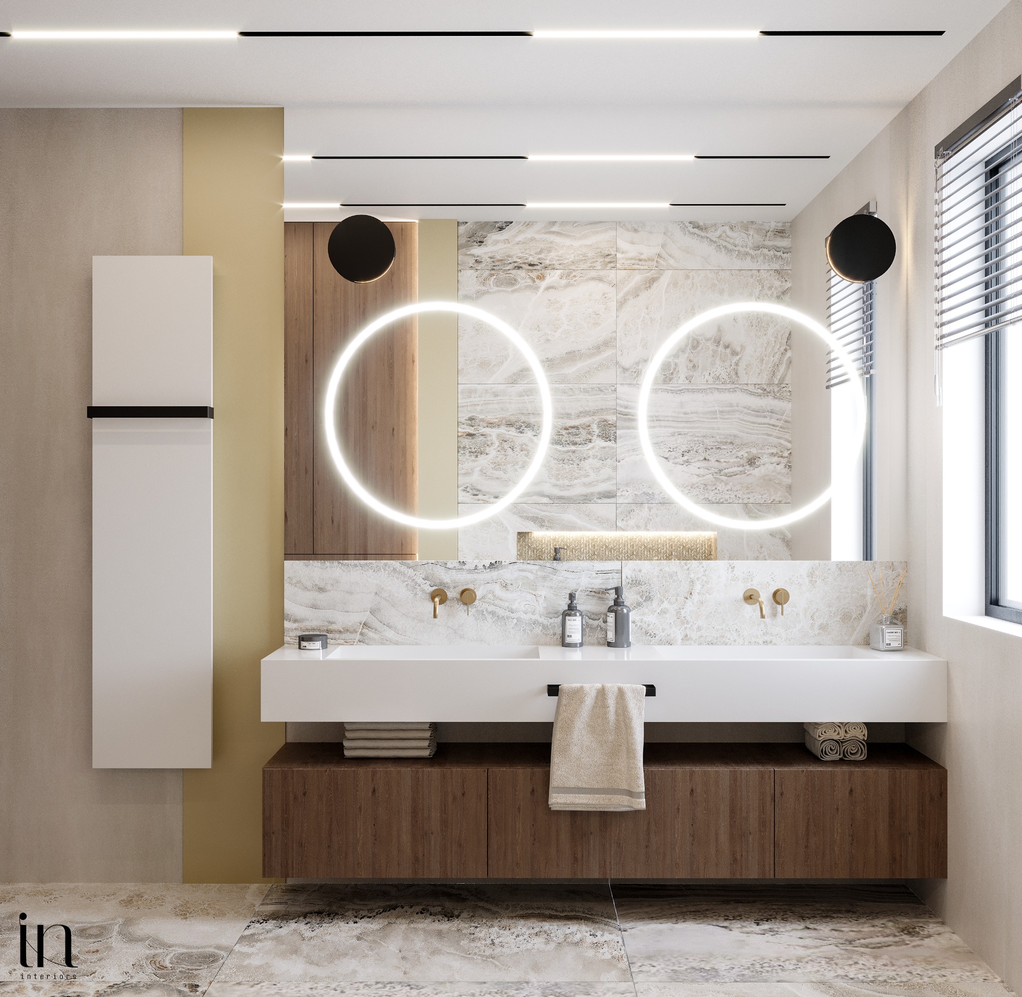 Nowoczesna łazienka z podwójną umywalką, okrągłymi lustrami z podświetleniem LED, marmurowymi płytkami, drewnianą szafką pod umywalką i minimalistycznymi bateriami w kolorze złota.
