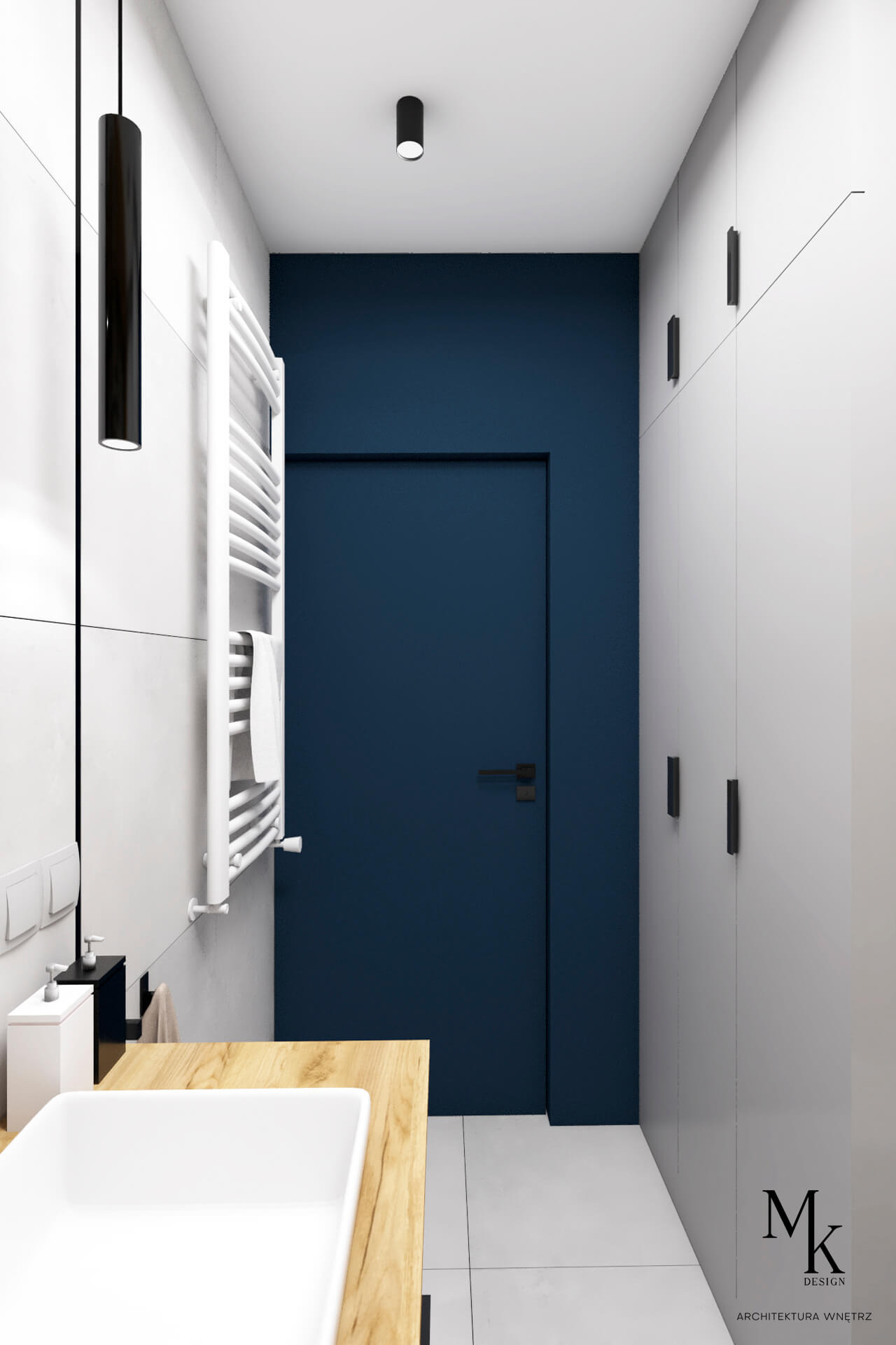 Nowoczesna łazienka z drewnianym blatem pod umywalką, białą grzejnikiem drabinkowym, granatowymi drzwiami i szafkami w kolorze złamanej bieli z minimalistycznymi uchwytami. Na ścianie zamontowany...