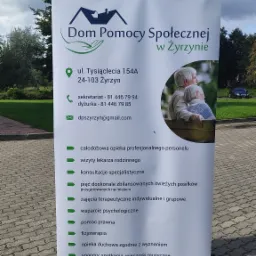 Roll-up reklamowy Domu Pomocy Społecznej w Żyrzynie, prezentujący ofertę placówki: całodobową opiekę, wizyty lekarskie, konsultacje, posiłki, zajęcia terapeutyczne, wsparcie psychologiczne, pomoc...