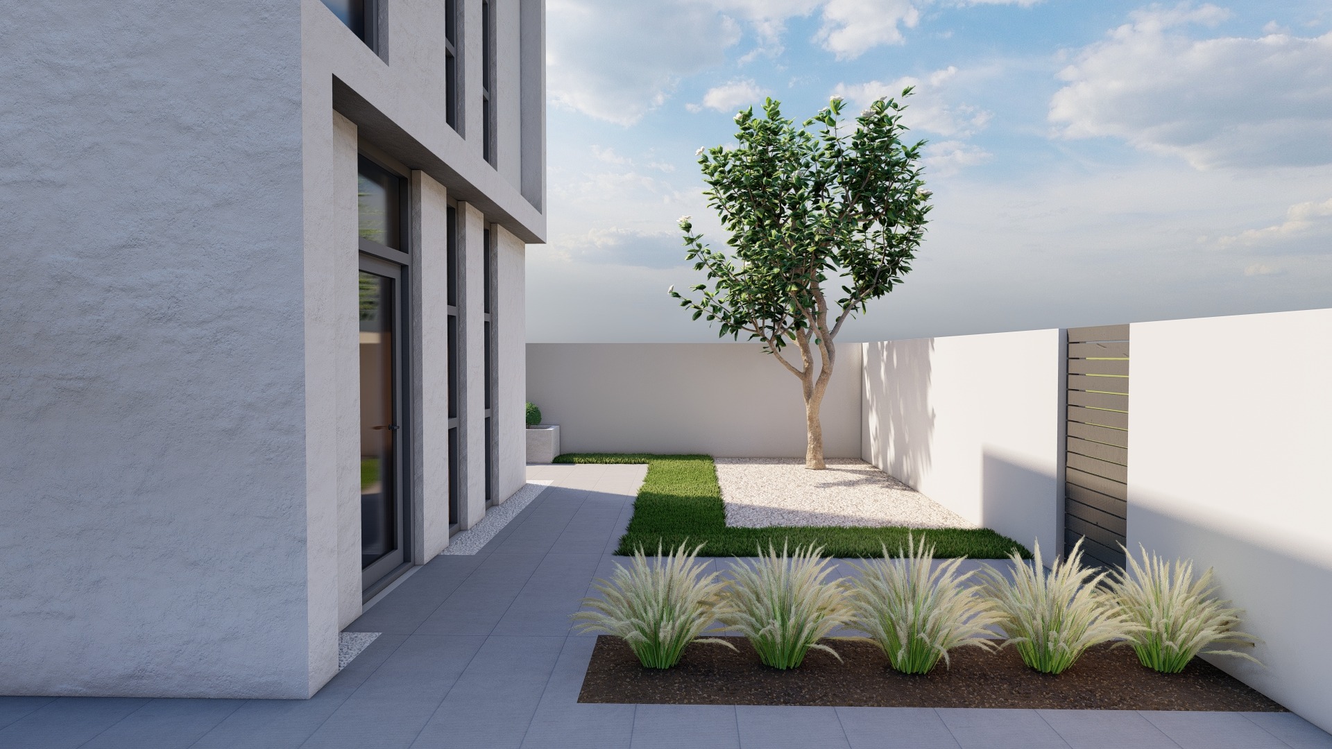 Nowoczesny ogród z białymi ścianami, jasnym żwirem, trawą i ozdobnymi trawami, z drzewem w centralnej części i minimalistyczną bryłą budynku w tle.