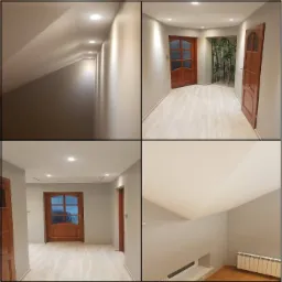 Korytarz po odświeżeniu z szarymi ścianami, drewnianymi drzwiami z szybami i jasnymi panelami podłogowymi, oświetlony punktowymi lampami sufitowymi.