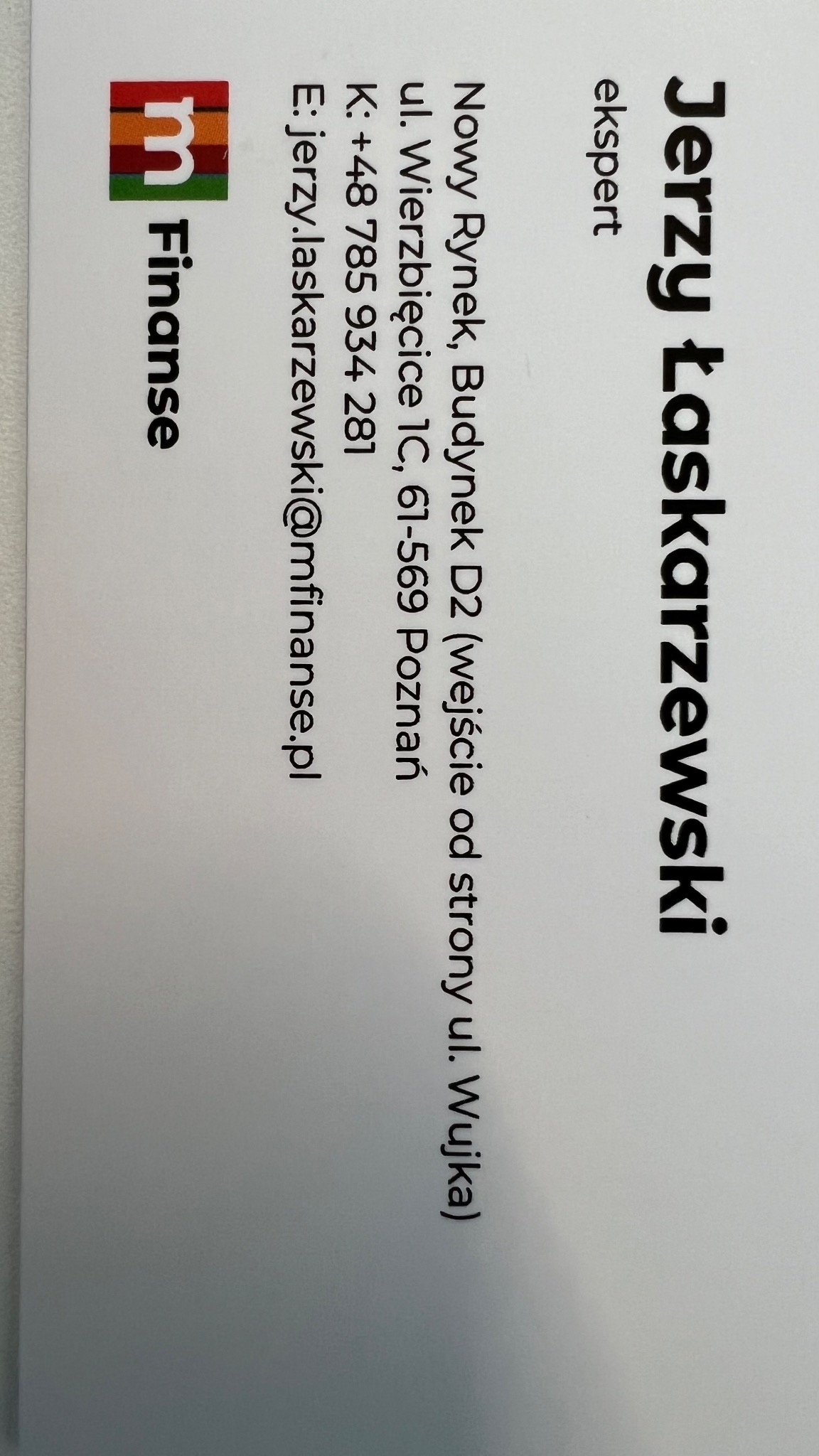 Wizytówka eksperta finansowego Jerzego Łaskarzewskiego z adresem biura w Poznaniu, numerem telefonu i adresem e-mail.