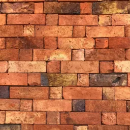 Tekstura ściany z cegły klinkierowej w odcieniach czerwieni i brązu, z widocznymi przebarwieniami i nierównościami na powierzchni cegieł.