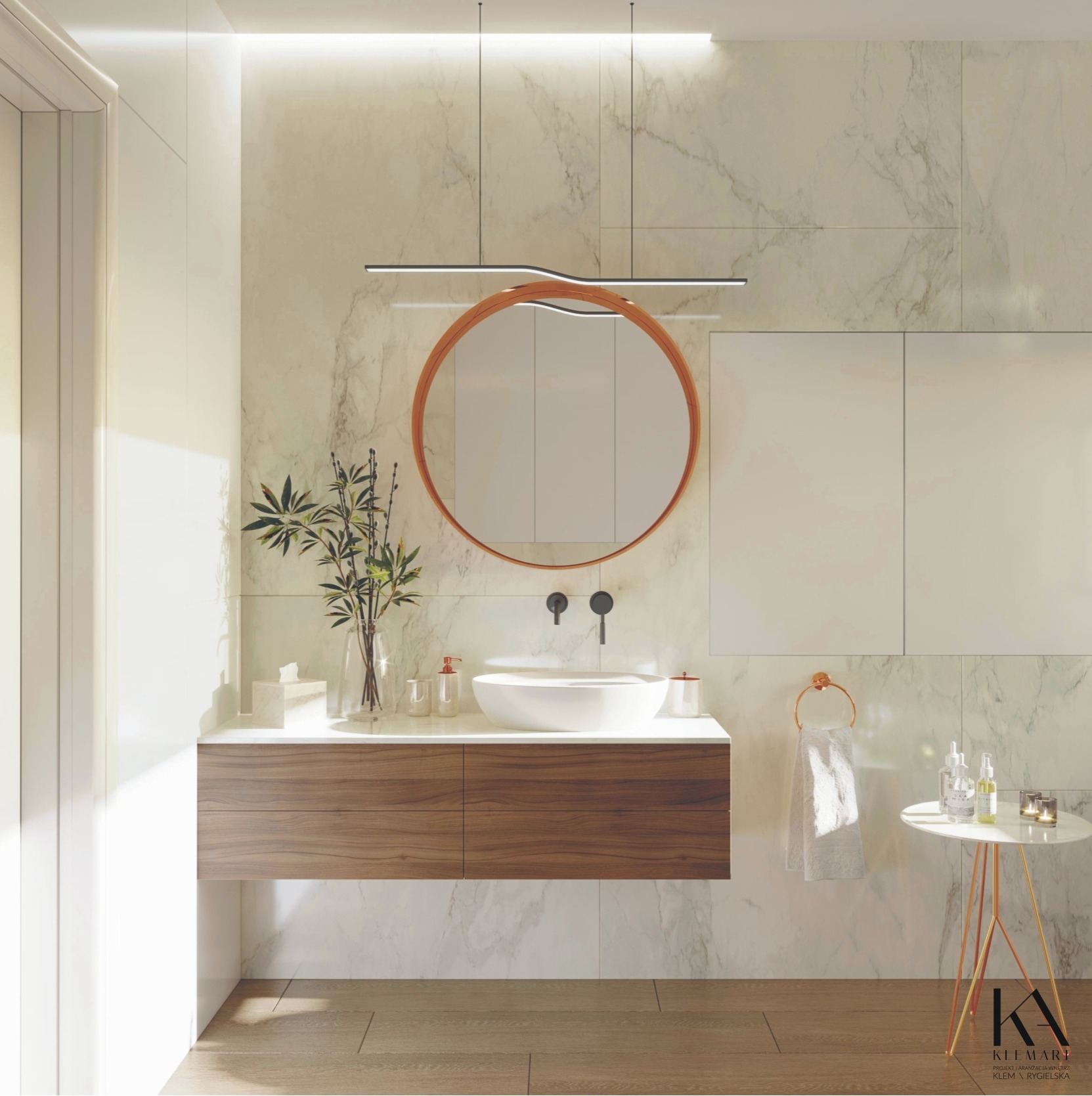 Nowoczesna łazienka z marmurowymi ścianami, okrągłym lustrem w miedzianej ramie, wiszącą szafką z drewnianymi frontami, białą umywalką nablatową i minimalistyczną lampą sufitową.