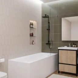 Nowoczesna łazienka z białymi i oliwkowymi płytkami, minimalistyczną armaturą w kolorze czarnym, prostokątną wanną i szafką umywalkową z drewnianymi frontami.