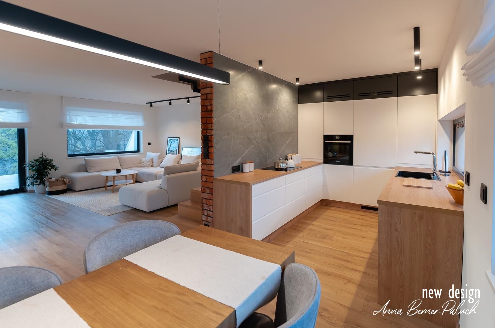 Nowoczesny salon, otwarta kuchnia z jadalnią. Oryginalne oświetlenie. designerski projekt wnętrza.