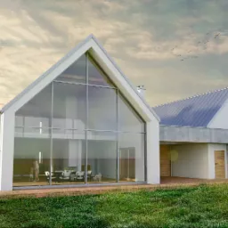 Wizualizacja nowoczesnego domu z dużą, przeszkloną ścianą szczytową, ukazująca wnętrze z jadalnią i rodziną, na zewnątrz taras z osobą siedzącą przy stoliku, otoczonego zielenią i drzewami.