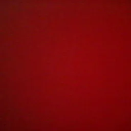 Jednolita, ciemnoczerwona powierzchnia z subtelną teksturą, oświetlona z lewej strony, tworząca delikatny gradient.