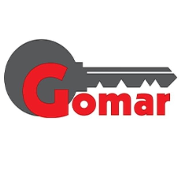 Logo firmy z kluczem w kolorze szarym i napisem 'Gomar' w kolorze czerwonym.