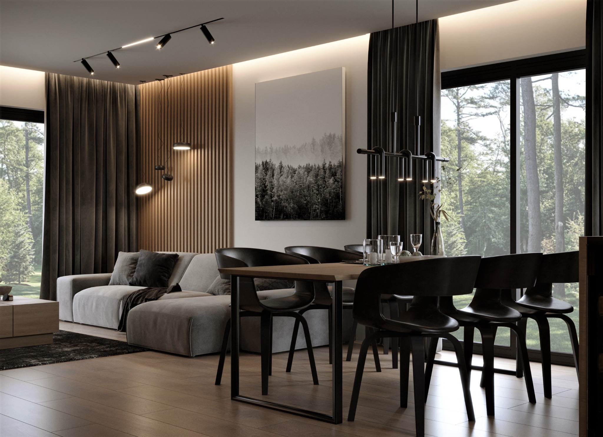 Nowoczesne wnętrze salonu z jadalnią: szary narożnik z poduszkami, drewniany stół z czarnymi krzesłami, parkiet, pionowe lamele na ścianie, grafika z motywem lasu, oświetlenie szynowe i wisząca...