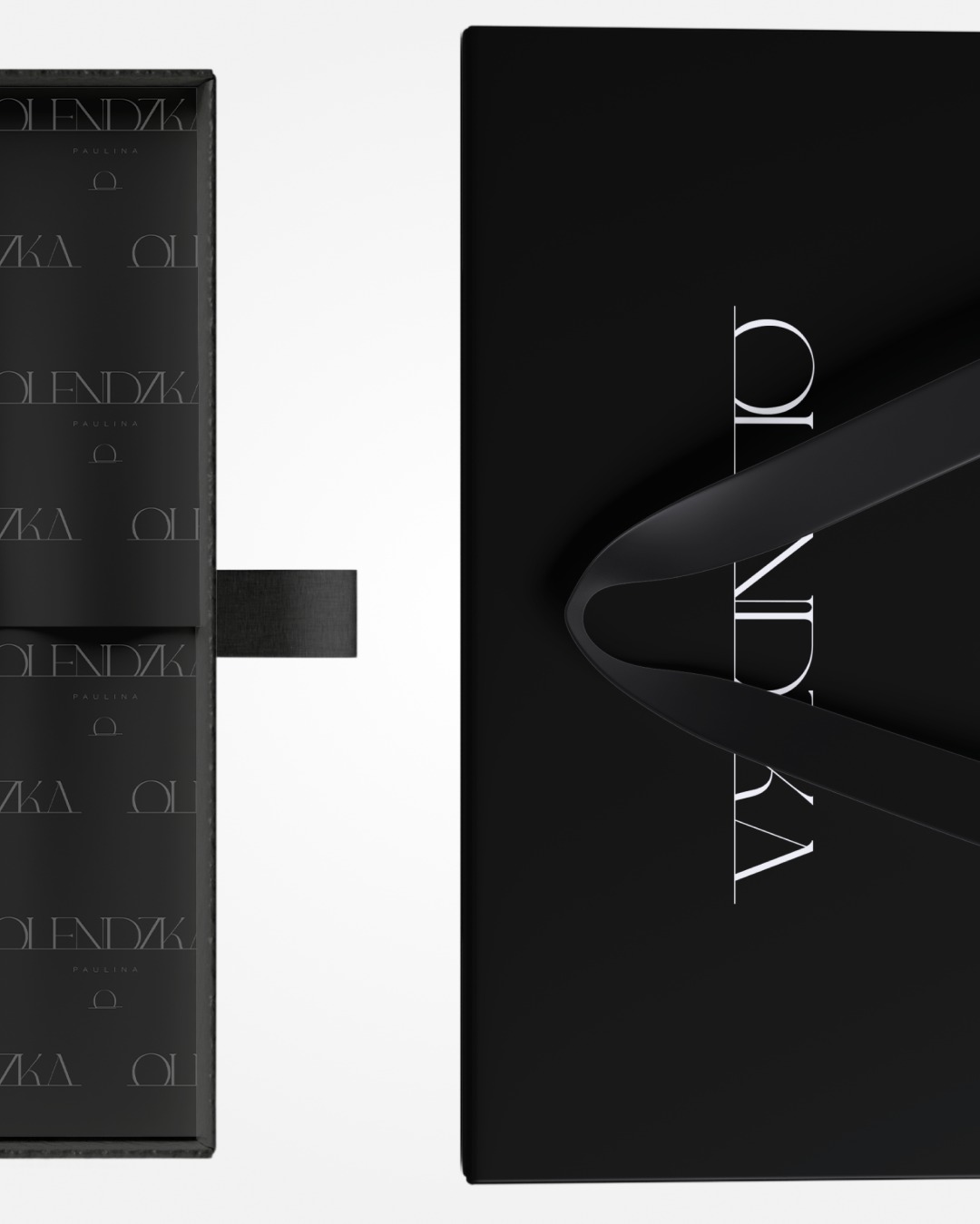 Czarne pudełko i torba prezentowa z minimalistycznym logo 'OLENDZKA PAULINA' w odcieniach szarości i bieli, elegancki design, matowe wykończenie.