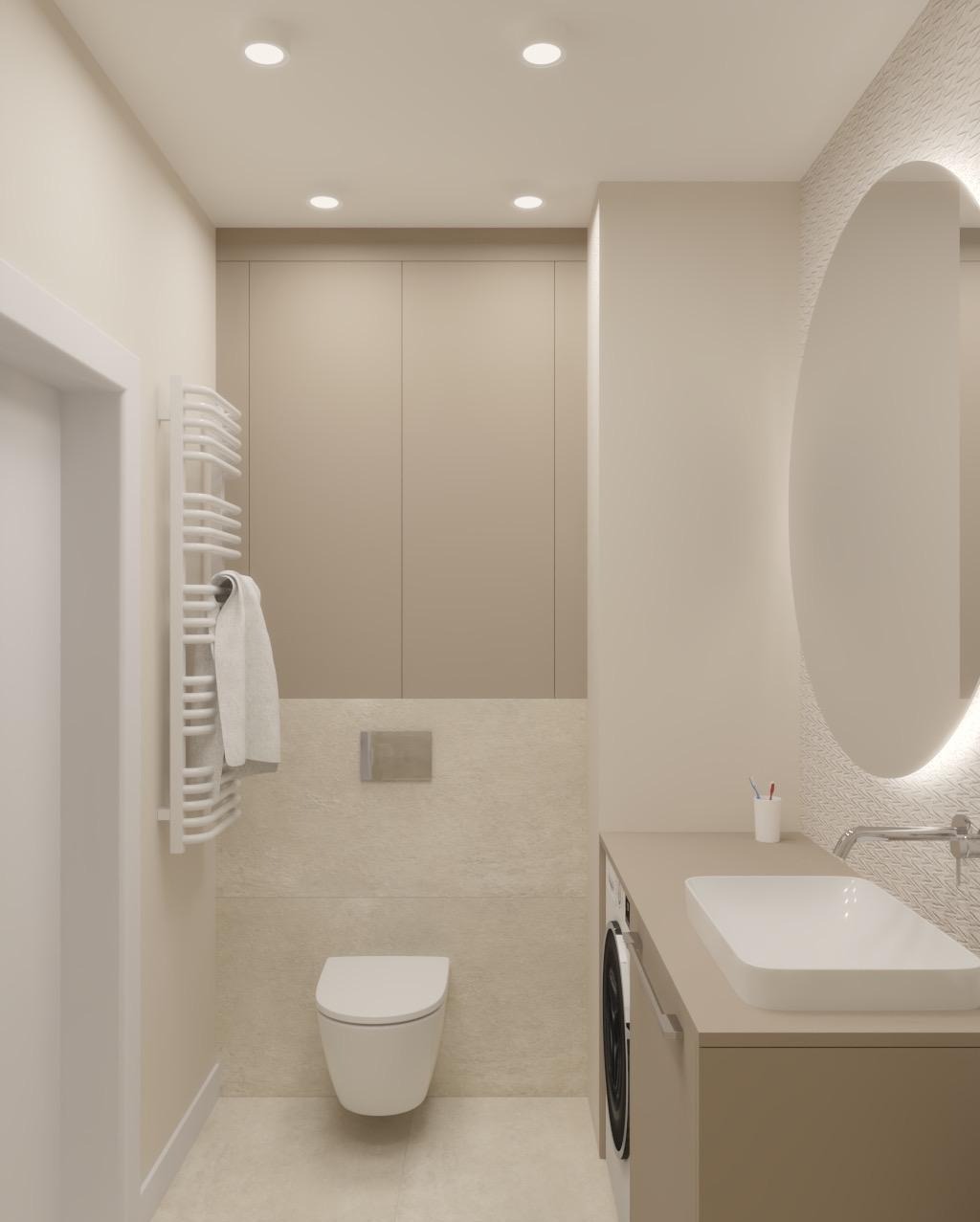 Beżowa łazienka z owalnym lustrem podświetlonym LED, wiszącą toaletą i grzejnikiem drabinkowym z ręcznikiem. Minimalistyczny design, stonowana kolorystyka.