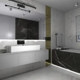 Nowoczesna łazienka z marmurowymi ścianami, białą szafką umywalkową z prostokątną umywalką nablatową, podświetleniem LED pod wanną obudowaną czarnym marmurem oraz złotymi lamelami dekoracyjnymi.