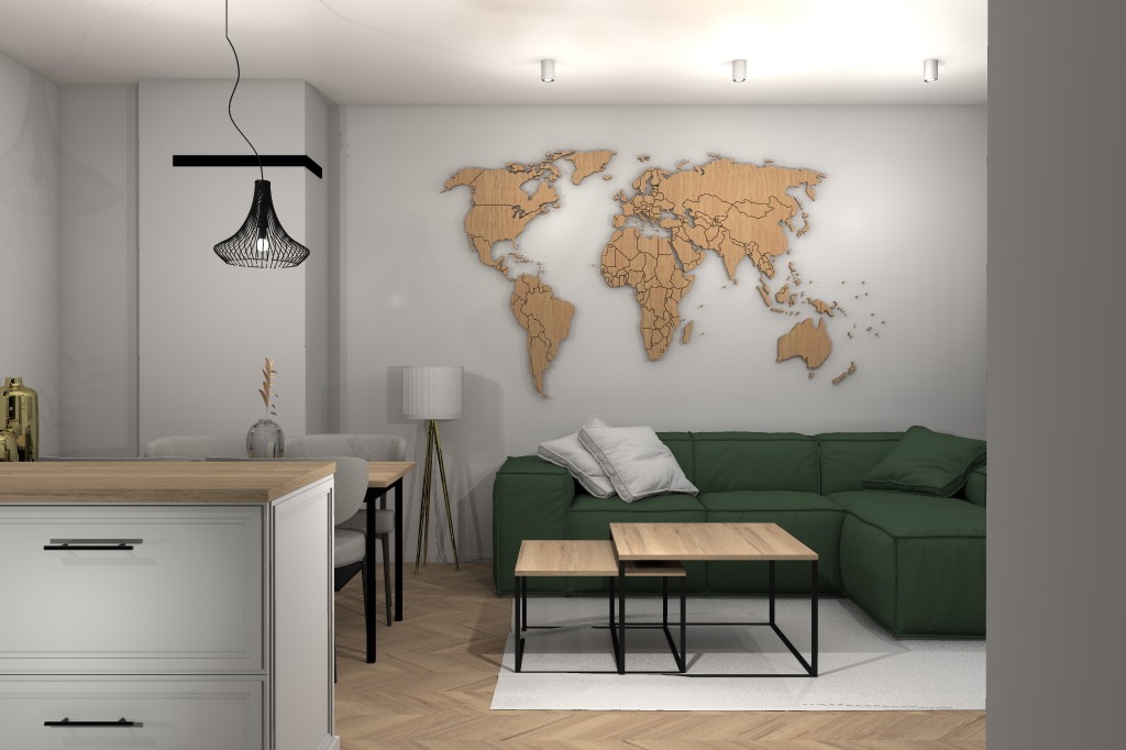 Nowoczesny salon z drewnianą mapą świata na ścianie, zieloną sofą narożną i zestawem stolików kawowych o drewnianym blacie i czarnych nogach. Nad stołem jadalnym wisi designerska lampa o ażurowym...