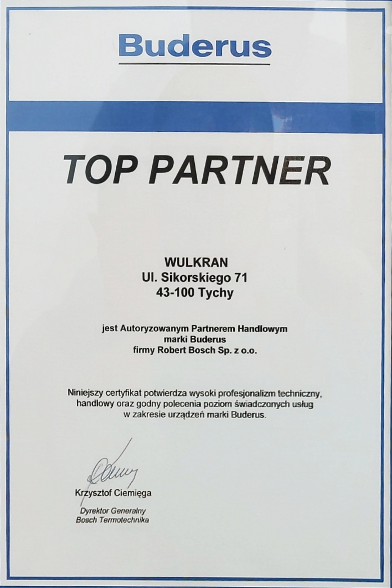 Certyfikat 'TOP PARTNER' firmy WULKRAN, autoryzowanego partnera handlowego marki Buderus, z adresem w Tychach i podpisem dyrektora generalnego Bosch Termotechnika, Krzysztofa Ciemięgi.