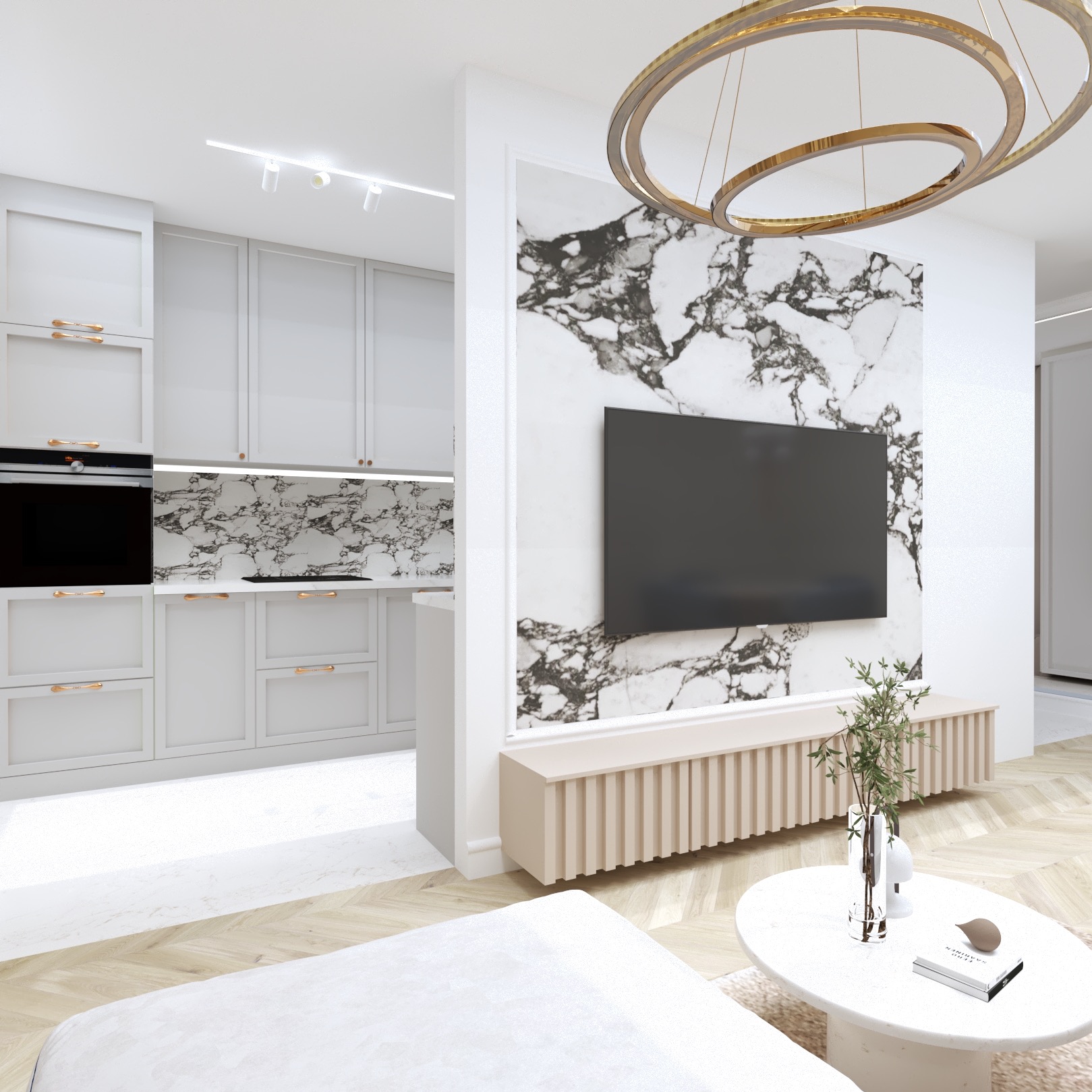 Nowoczesne wnętrze: biała kuchnia z marmurowym backsplashiem, salon z TV na marmurowej ścianie i okrągłym stolikiem kawowym. Złoty, okrągły żyrandol.