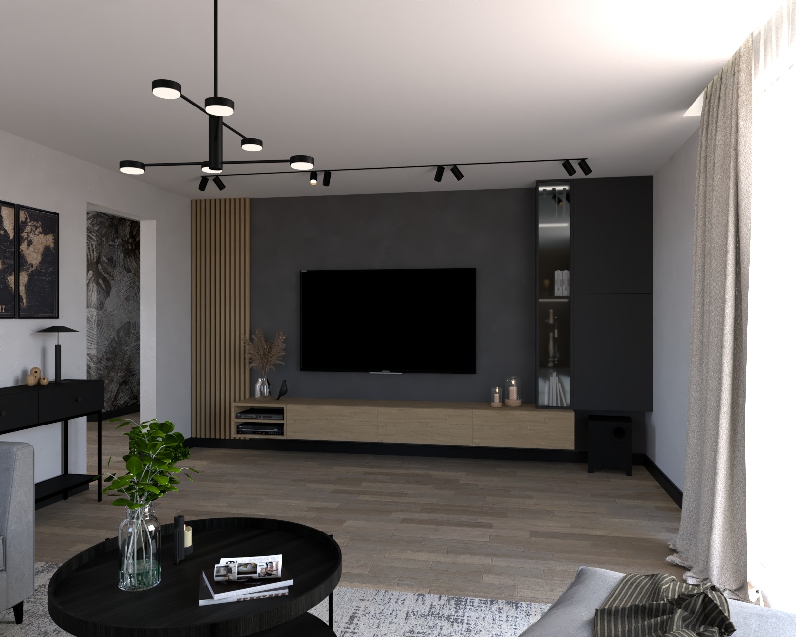 Nowoczesny salon z ciemnoszarą ścianą za telewizorem, jasną drewnianą szafką RTV, czarną szafką z przeszklonymi drzwiczkami, okrągłym stolikiem kawowym z rośliną w szklanym wazonie i lampą sufitową...