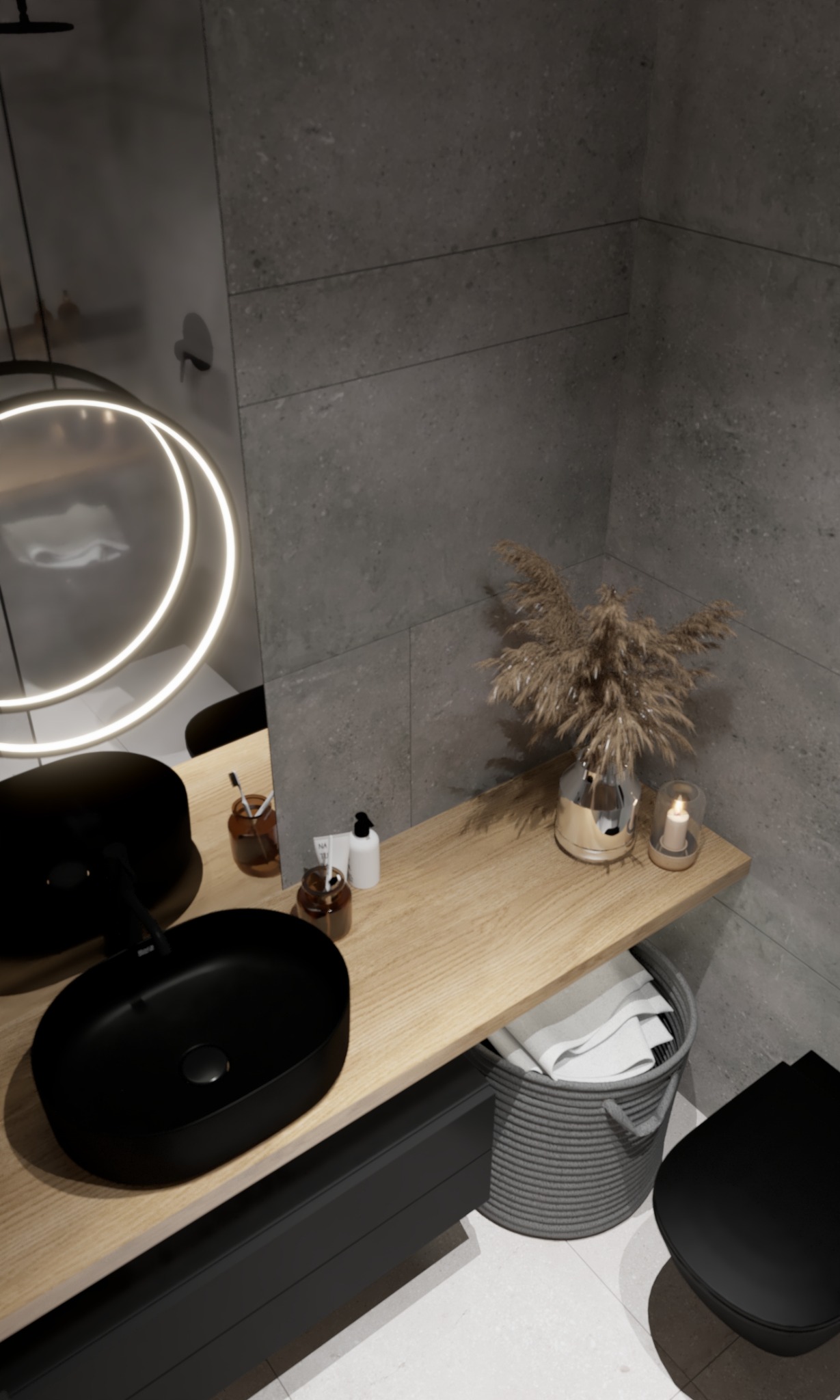 Nowoczesna łazienka z czarną umywalką nablatową, okrągłym lustrem z podświetleniem LED, drewnianym blatem i szarą ścianą z płytek imitujących kamień.