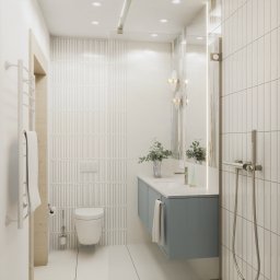 DESIGN ME Studio - Nowoczesna łazienka w bieli i błękicie z akcentami drewna. Umywalka z szafką, toaleta i grzejnik ręcznikowy. Minimalistyczny design, pionowe płytki i oświetlenie LED.