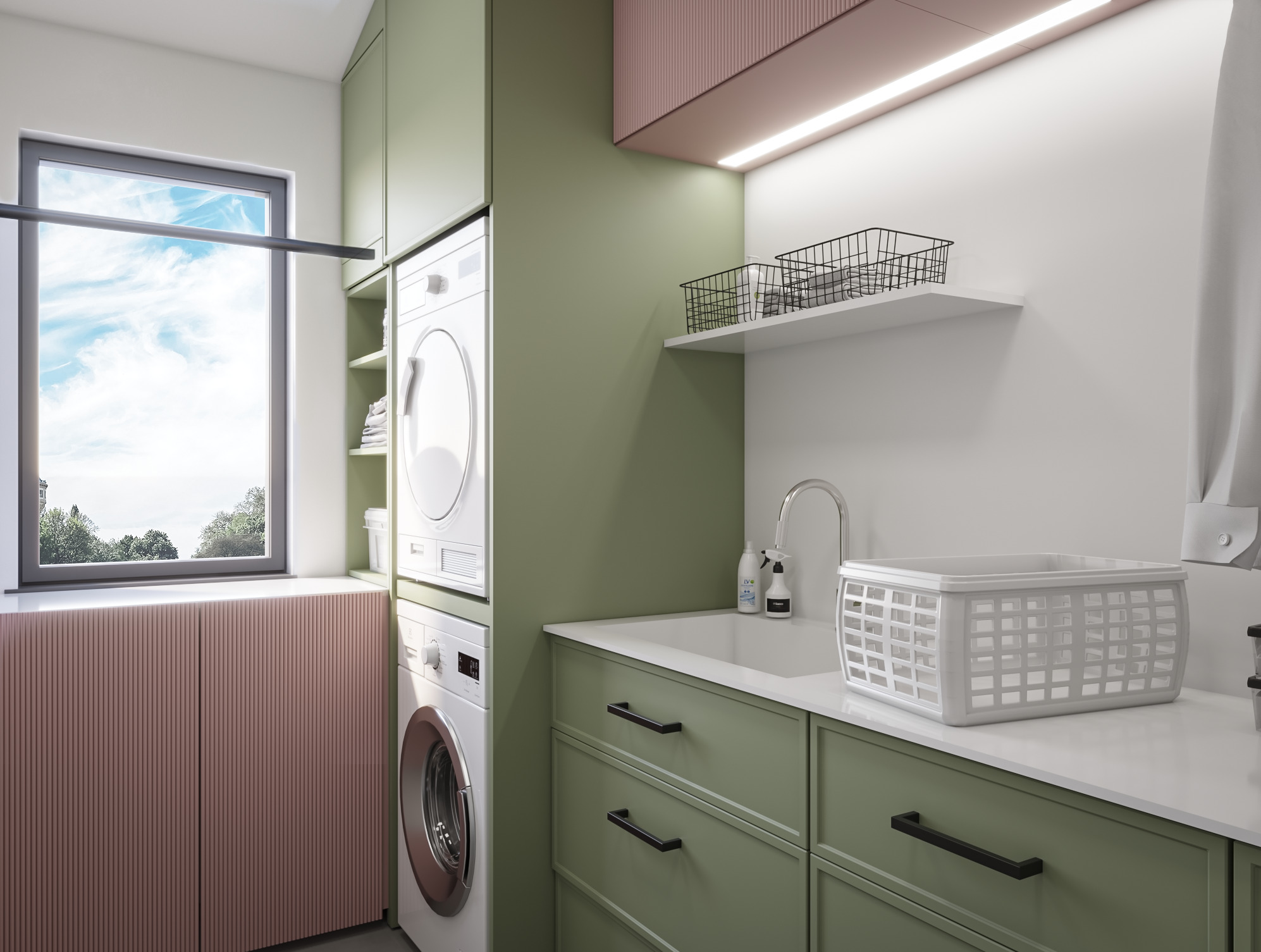 Nowoczesna pralnia z zielonymi szafkami, pralką i suszarką w kolumnie, białym zlewem i koszem na pranie na blacie.