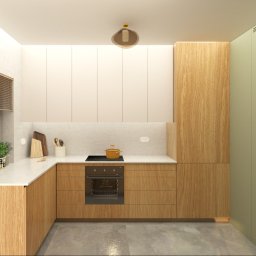 Coren Studio Design - Wizualizacja kuchni z drewnianymi szafkami, marmurowym blatem i zieloną ścianą. Na blacie stoi garnek, a obok okna widać zioła w doniczce.