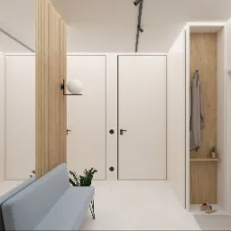 Minimalistyczne wnętrze z drewnianą ścianką działową, błękitną sofą i ukrytymi drzwiami. Oświetlenie punktowe i rośliny doniczkowe dodają przytulności.