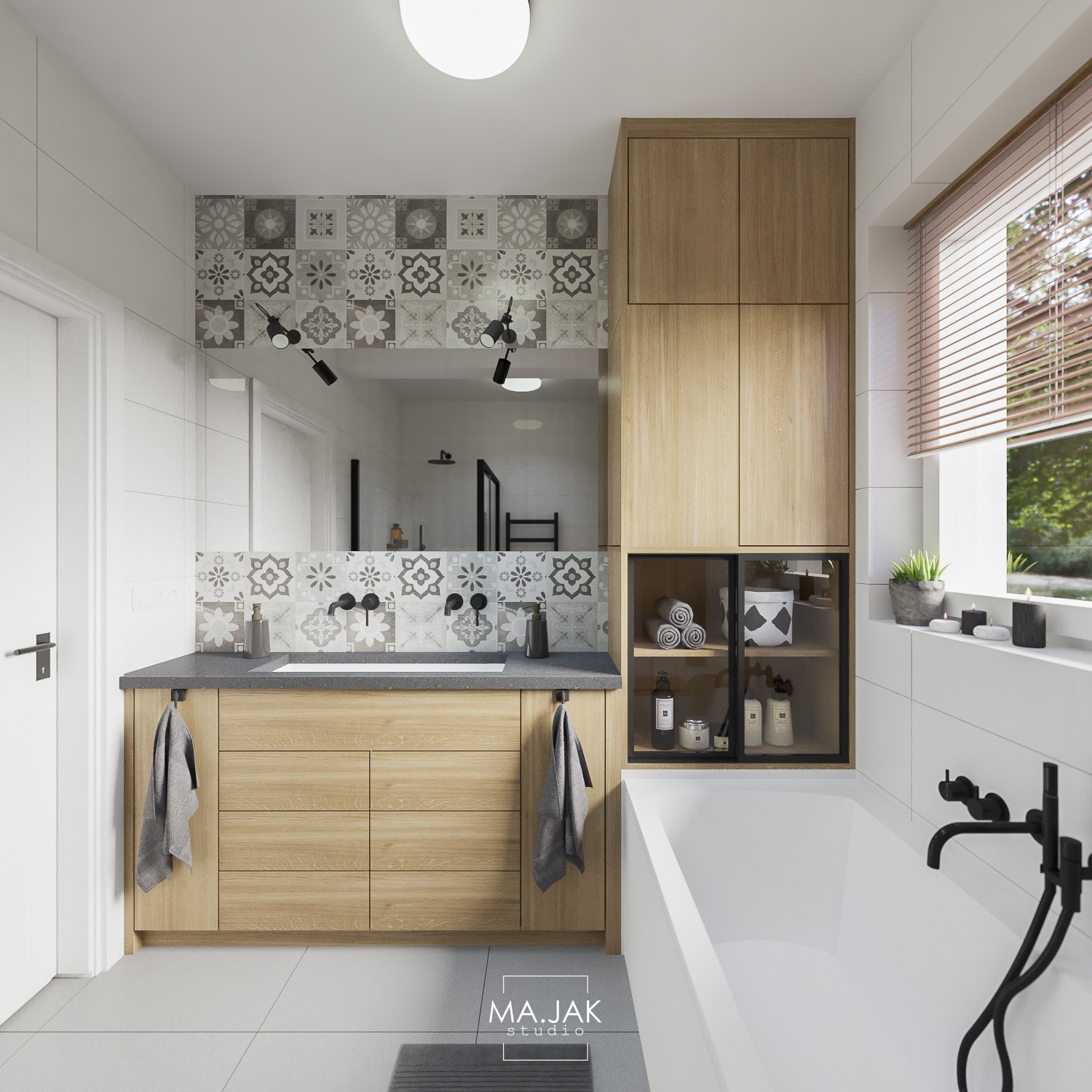 Nowoczesna łazienka z drewnianą szafką pod umywalką, wzorzystymi płytkami nad blatem, białą wanną z czarną armaturą i oknem z żaluzjami.
